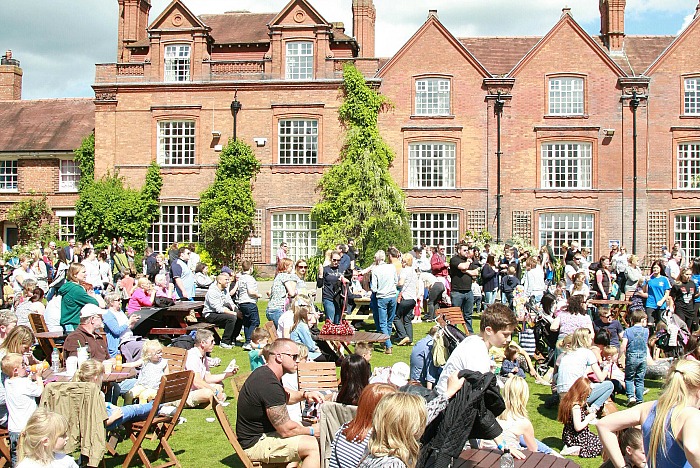 family festival - Visitors enjoying the sunshine on the main lawn