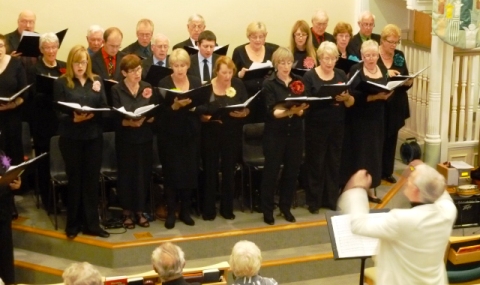 Phil Houghton conducts the Wistaston Singers in Ludlow