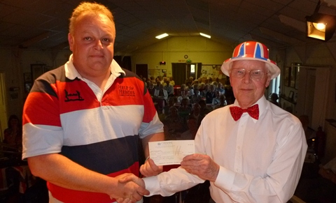 Steve Pragnell (left) receiving the cheque from Alan Newton