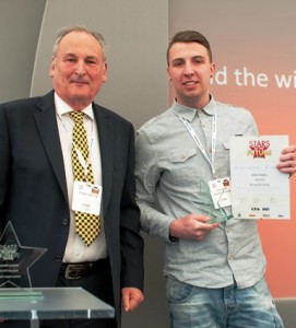 adam Hughes of Gunn JCB with Richard Noble MBE, regional winner