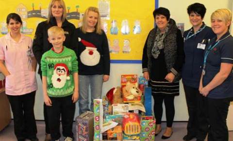 Caroline Cooper (General Manager) and Julie Butterfield (Payroll Administrator) from Cooper Buckley Haulage donate gifts to staff on CAU.