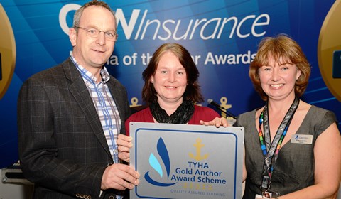 Robert & Andrea Parton receive award from Sarah Treseder CEO RYA FS