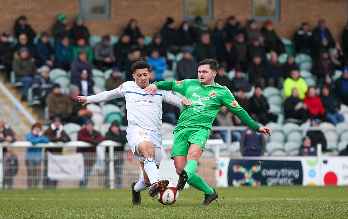 First-half v Buxton - Caspar Hughes fights for the ball in front of The Swansway Stand (1)