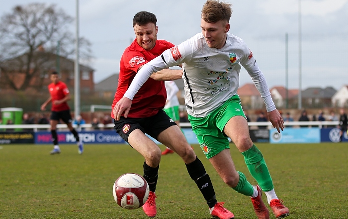 Second-half - Jacob Bickerstaff is calm on the ball under pressure from FCUM (1)