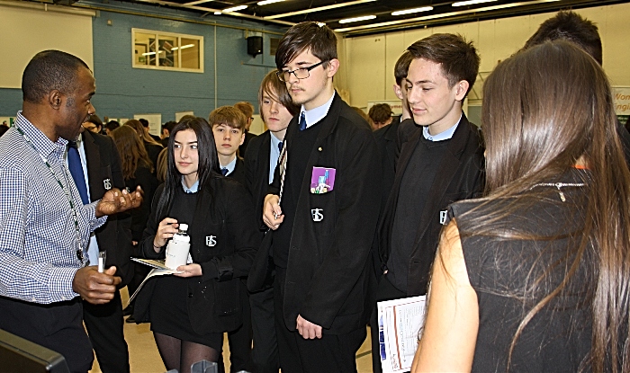 A group of students listen attentively as Basil Gaynor from Epredia explains an aspect of medical technology