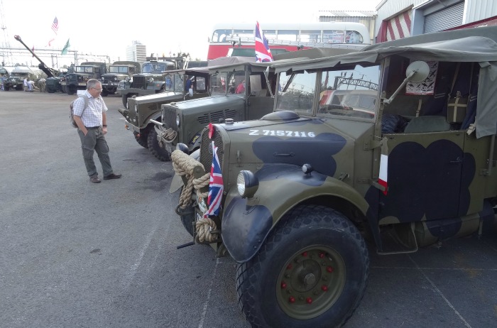 A visitor views a military vehicle display