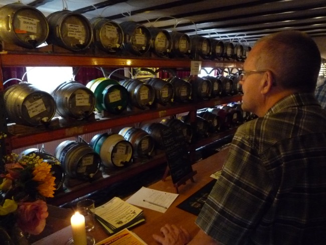 A visitor views the cask ales inside The Globe Pub