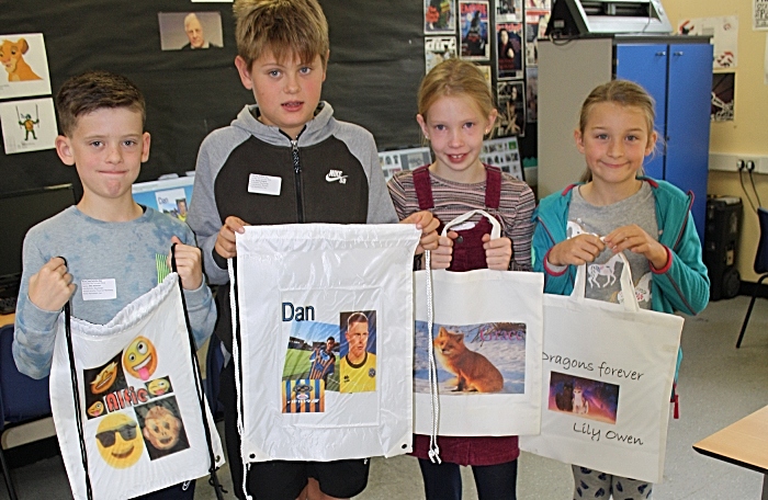 Alfie Bateman, Dan Pollard, Grace Davies and Lily Owen eagerly await to use their newly printed bags