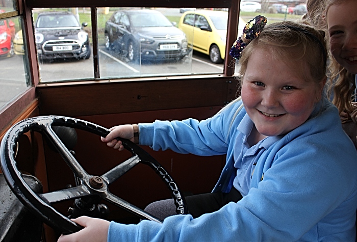 All aboard! Frankie Cliff tres her hand in the driver's seat of Mr Emerton's vintage bus (1)