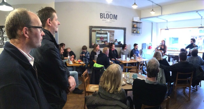 Audience watches Hannah White accompanied by Keiron Marshall at Bloom