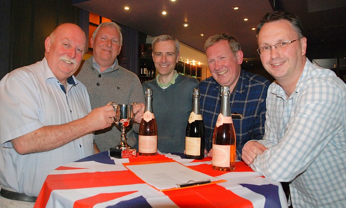 quiz - BCR managing director Phil Wood hands over the trophy to triumphant winners from NatWest business banking team