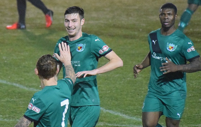 Ben Harrison celebrates his goal against Sutton Coldfield with teammates Steve Jones and Khaellem Bailey-Nicholls