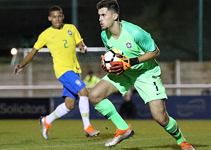 Brazil keeper Gabriel Roberto Pereira confidentially holds the ball