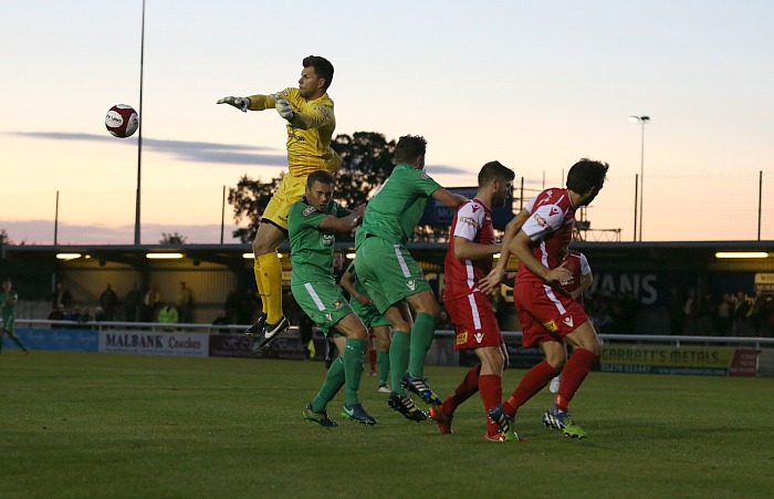 Buxton goalkeeper Jan Budtz clears the ball