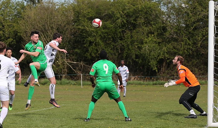 Callum Saunders heads towards goal as keeper Greg Hall awaits (1)