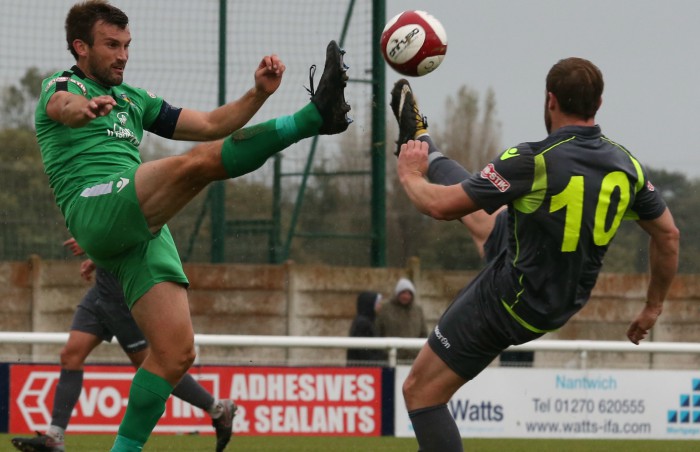 Captain Sam Hall challenges for the ball v Witton