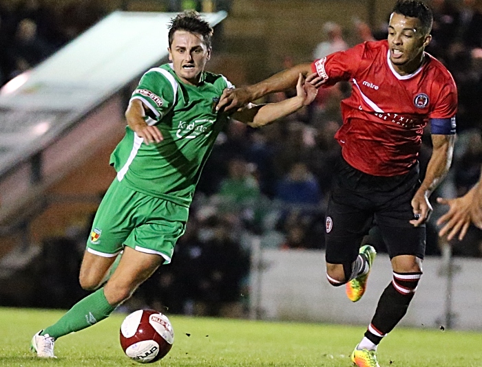 Caspar Hughes eyes the ball under pressure (1)