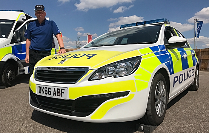 policing - cheshire police recruitment - Cheshire Constabulary - PCSO Nick Jarvis with a police car (1)