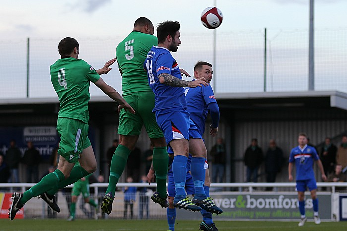 Clayton McDonald heads home the winning goal v Whitby