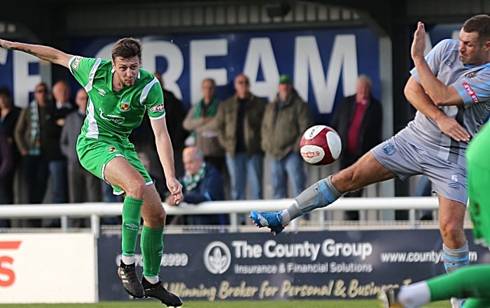 Craig Lindfield shoots at goal from long-range v Workington