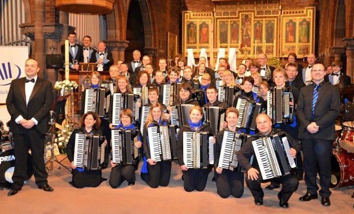 accordion orchestra from twin town to perform with Crewe Brass