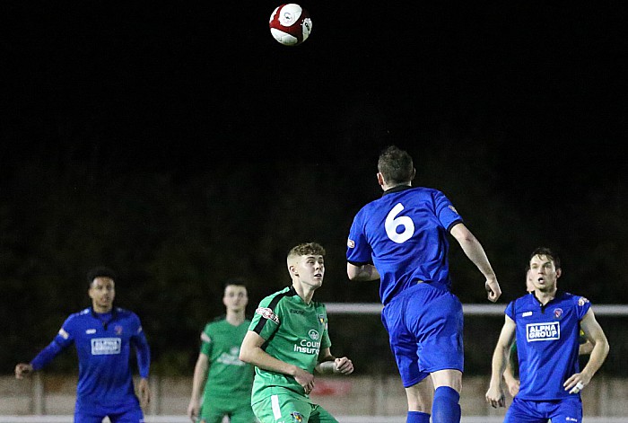 Droylsden player Danny Ventre heads the ball