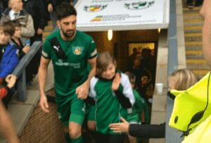 Lucky charm Emily with Mat Bailey in players tunnel