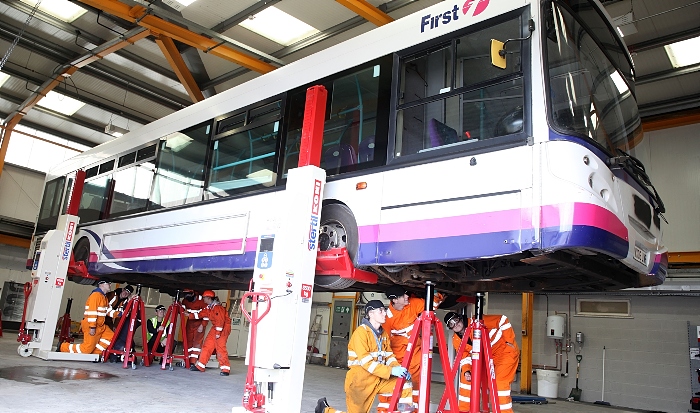 First Bus Group B apprentices with jacked up bus (1)