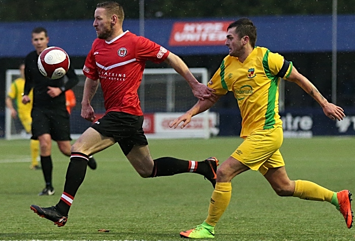 First-half - Caspar Hughes challenges for the ball