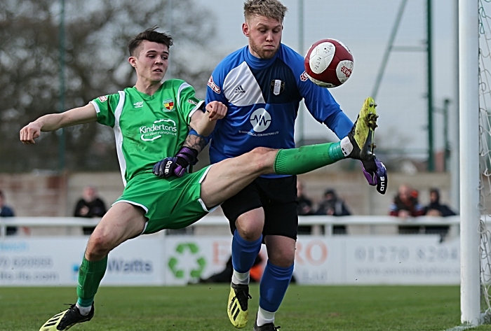 First-half - Joe Malkin challenges for the ball from Grantham keeper Sam Andrew (1)