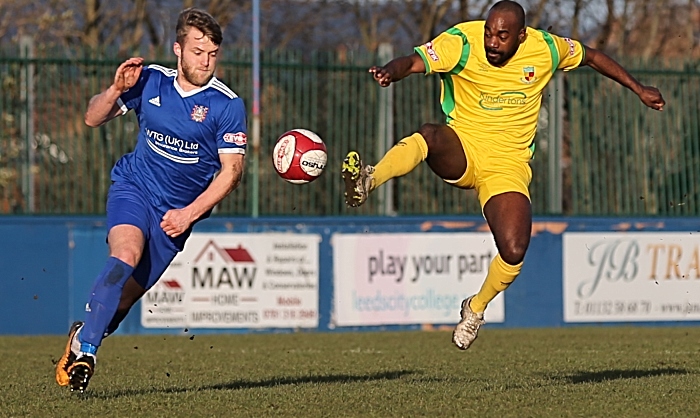 First-half - Joe Mwasile fights for the ball