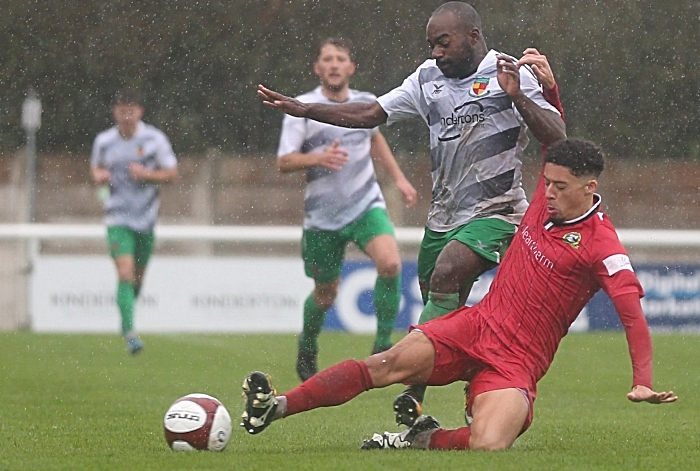 First-half - Joe Mwasile is challenged for the ball (1)