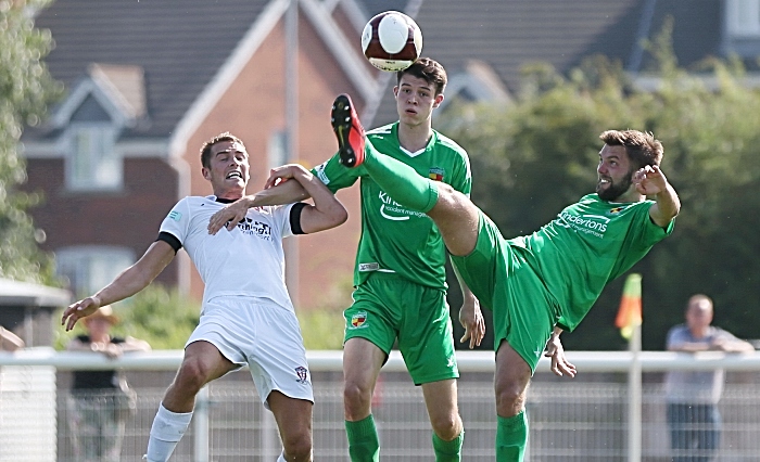 First-half - Nantwich Towns Joe Davis gets to the ball first (1)