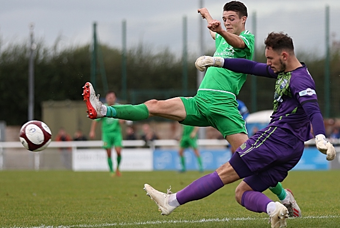 First-half - Radcliffe FC keeper Oliver Martin clears under pressure from Joe Malkin (1)