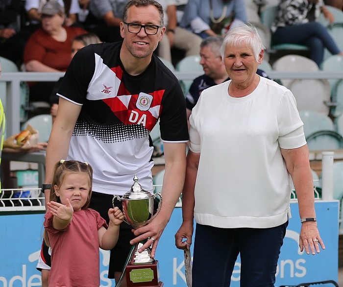 Freyja Routledge (granddaughter of Barry Daly) and Judith Daly (wife of Barry Daly) present Barry Daly Memorial Trophy to Dave Artell , Crewe Alex manager