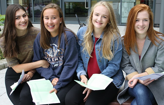 Friends, Orla Nutkins, Sophie Stringer, Beth Kilby and Rachel Hadfield relax together now that the GCSE wait is over