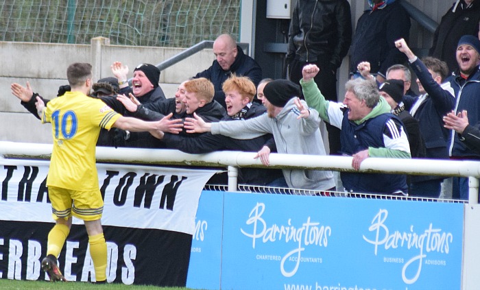 Grantham goalscorer Lee Shaw celebrates with fans