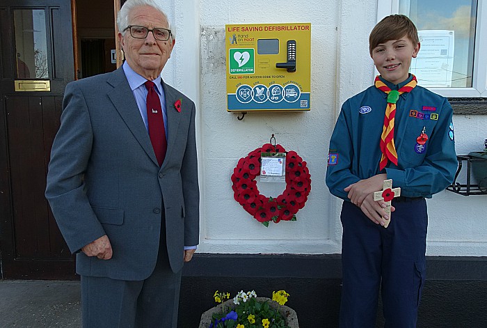 Wistaston Hall President John Cooke places wreath and Scout George Edge-Robinson places a cross at the front of the Hall