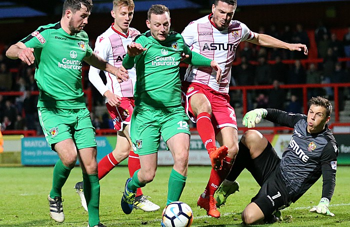 Harry Clayton and David Forbes fight for the ball