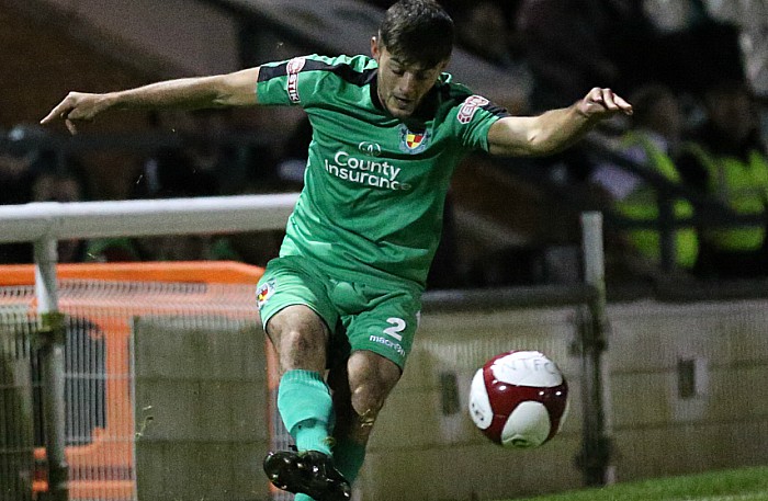 Jake Phillips crosses the ball into the danger area