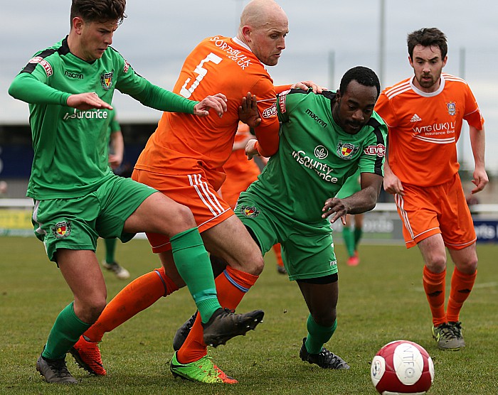 Jamie and Joe Mwasile eye the ball