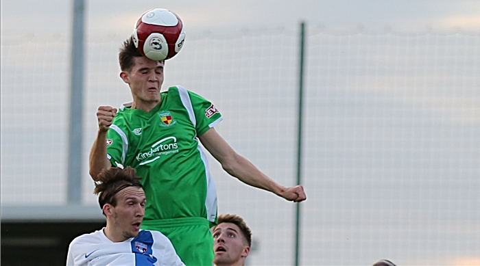 Joe Malkin climbs high to head the ball