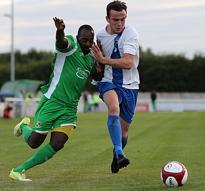 Joe Mwasile challenges for the ball (2)