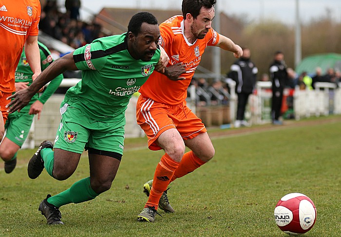 Joe Mwasile fights for the ball