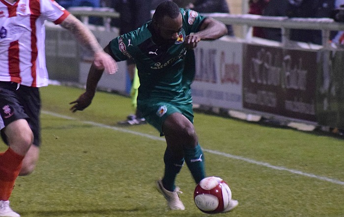 Joe Mwasile powers forward for Nantwich Town FC v Lincoln