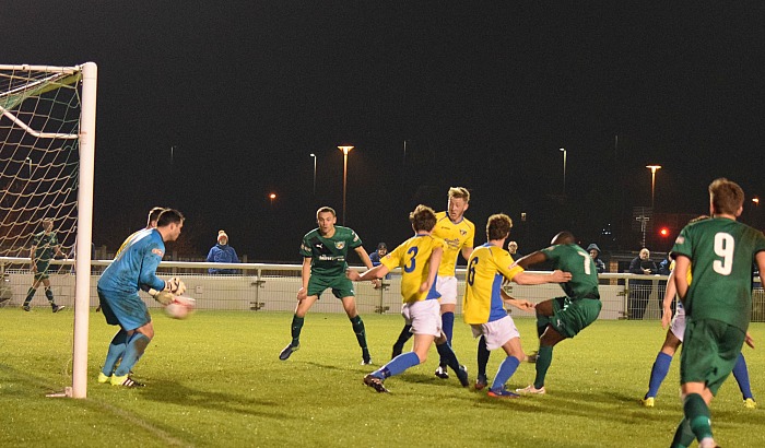 Joe Mwasile scores the second goal after turning in a loose ball in the penalty area