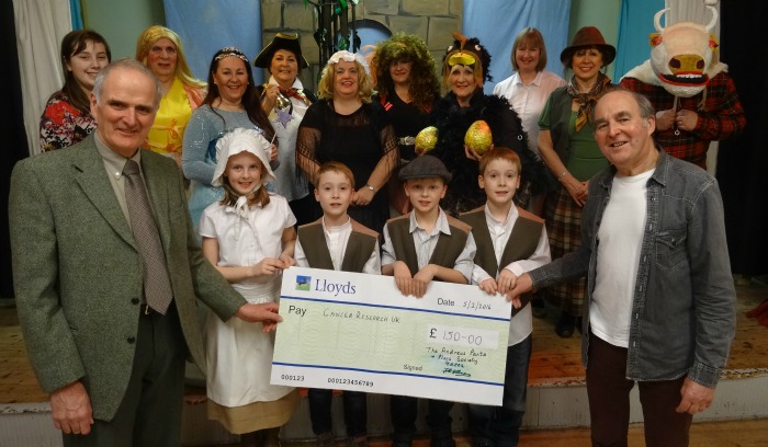 TAPPS - John Pass (left) receives the cheque from Fred Allman (right) with the panto cast