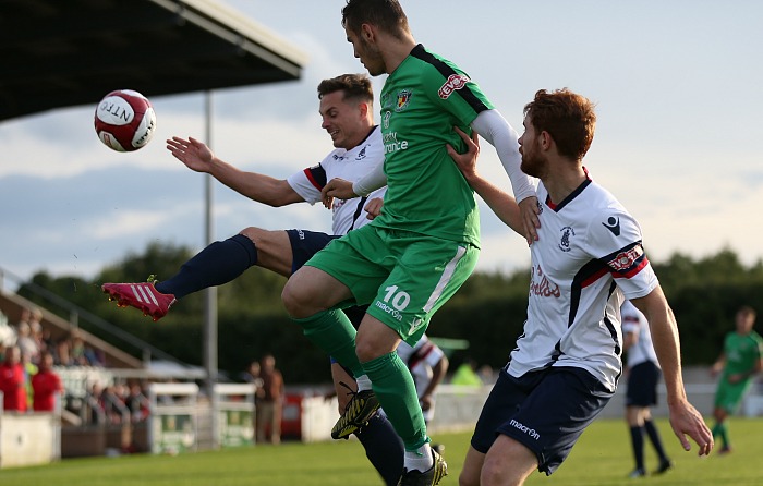 Jordan Davies challenges for the ball