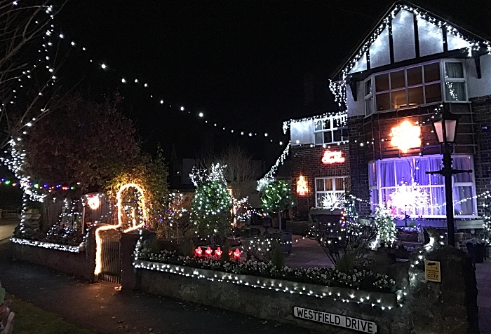 Laurence Perrys home lit up at nighttime (2)