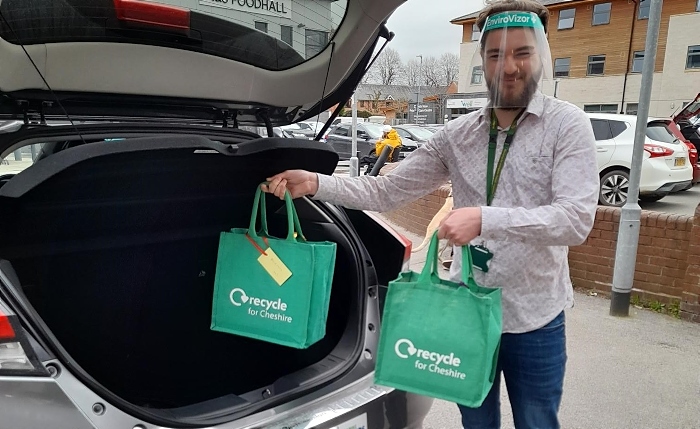 Liam at back of electric vehicle - libraries